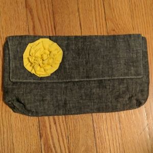 Denim like lightweight clutch with flower accent